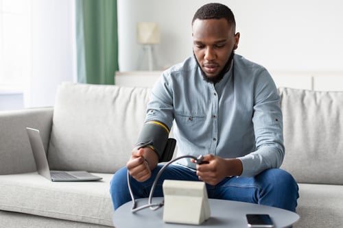 patient_taking_reading_blood_pressure_monitor